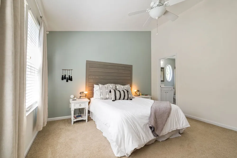 Quiet modern bedroom, comparing water vs air cooling mattress pads